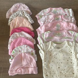 Lot of onesies and hat.